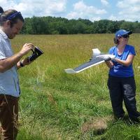 Dr. Holly Jones works with a drone to study a 4,000 acre prairie. Photo: Parrot