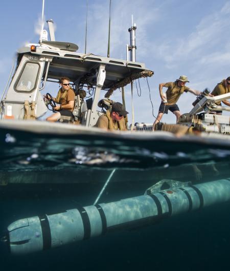 A Mk 18 Mod 2 UUV is launched from a boat in a mine detection demonstration. Photo: U.S. Navy