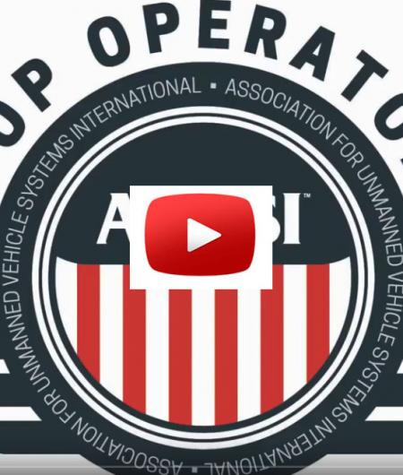 The TOP logo with video button overlay.