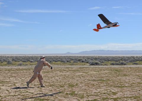 David Freeman, 412th Test Wing Emerging Technologies Combined Test Force, hand launches a small unmanned aircraft system in the north part of Edwards Air Force Base, California, Feb. 27. (U.S. Air Force photo by Kenji Thuloweit)