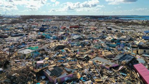 Drone imagery shows brightly colored homes crumpled in a cluster of ruin after the fury of Hurricane Dorian’s landfall in the Abaco Islands. Photo credit: AIRT