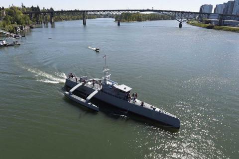 Sea Hunter, a medium-sized USV, gets underway on the Williamette River, Portland, Oregon, 2017, following a christening ceremony. The Navy would like more USVs of all sizes. Photo: U.S Navy/John F. Williams