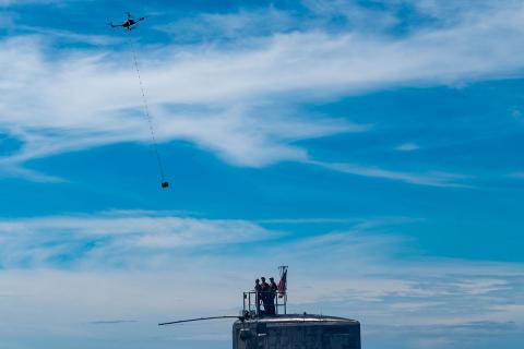 An unmanned aerial vehicle delivers a five-pound payload to USS Hawaii (SSN 776). Photo: U.S. Navy/MC1 Michael B. Zingaro