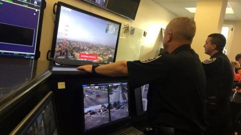 A watch commander views a drone feed. Photo: San Diego News-Tribune A watch commander views a drone feed. Photo: San Diego News-Tribune