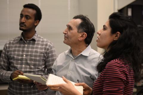 Abdollah Homaifar, Ph.D., (center) principal investigator and a NASA Langley Distinguished Professor in the College of Engineering (COE), with students. Photo: Alexander Saunders, College of Engineering director of communications