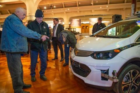 Jay Harris and The Henry Ford antique vehicle specialist Gordon Michael check out GM's first self-driving Bolt EV. Photo: Mandi Wright, Detroit Free Press
