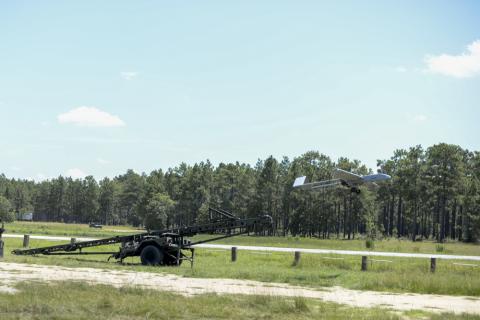 A RQ-7BV2 Shadow Unmanned Aerial System belonging the Detachment 1, D Co., 236 Brigade Engineer Battalion propels off its launcher at about 80 mph at an air field near Fort Bragg, Aug. 18, 2017. Photo by Staff Sgt. Mary Junell.