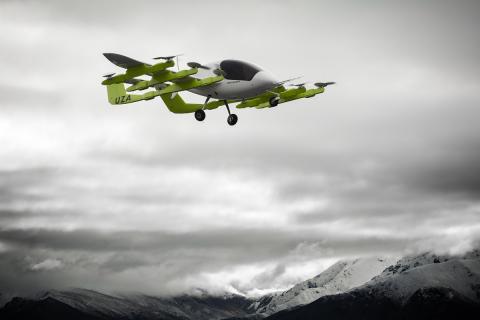 Wisk's self-flying, all-electric air taxi Cora flying in the cloudy skies. Photo: Wisk