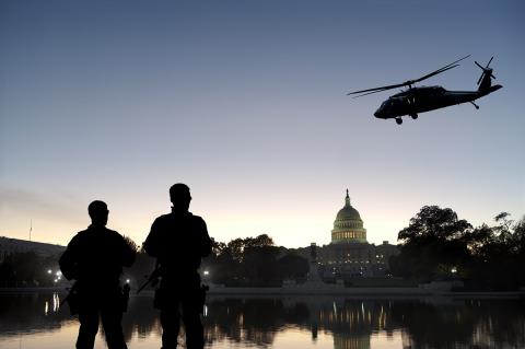 A stock photo of soldiers and a helicopter in front of the U.S. Capitol. A stock photo of soldiers and a helicopter in front of the U.S. Capitol.